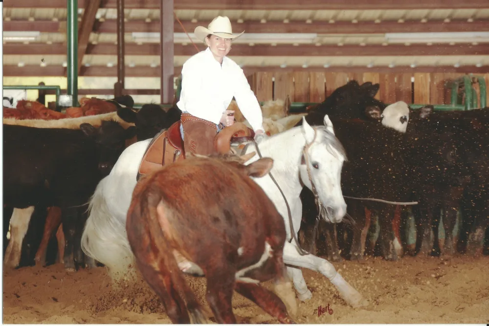 Carrie Hagglund competing in cutting horse